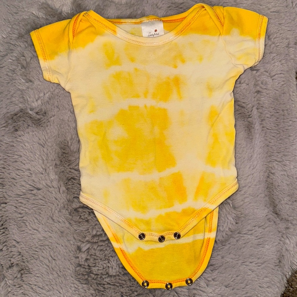 Yellow tie dye onesie